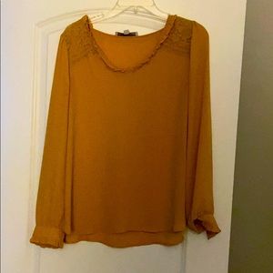 A mustard yellow blouse